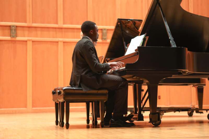 a man playing a piano