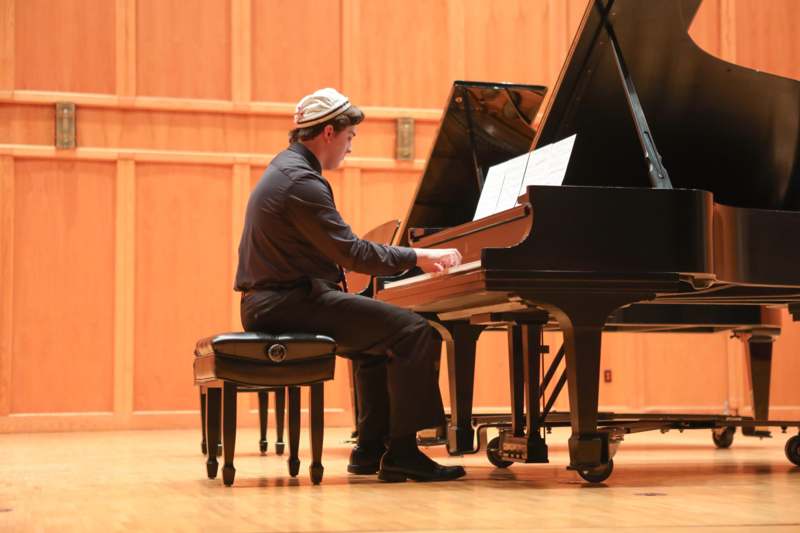 a man playing a piano