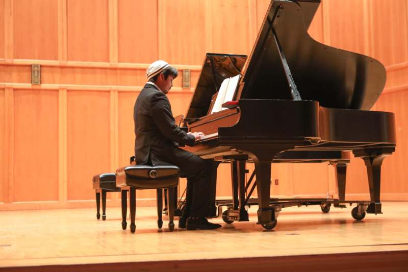 a man playing a piano