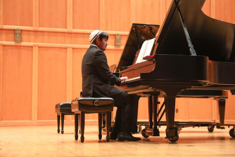 a man playing a piano