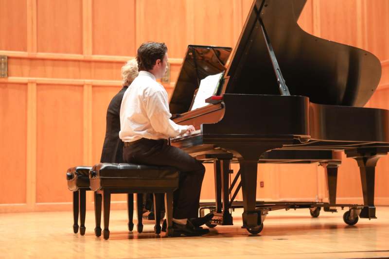 a man playing a piano