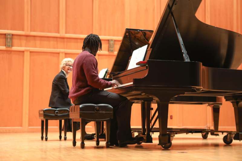 a man playing a piano