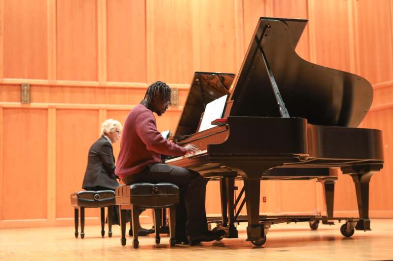 a man playing a piano