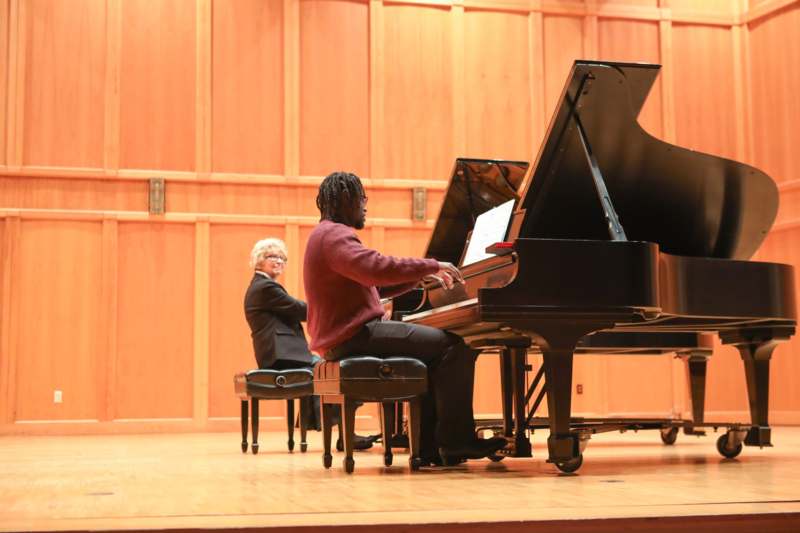 a man playing a piano