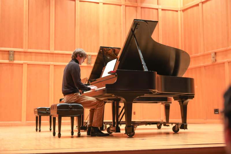 a man playing a piano