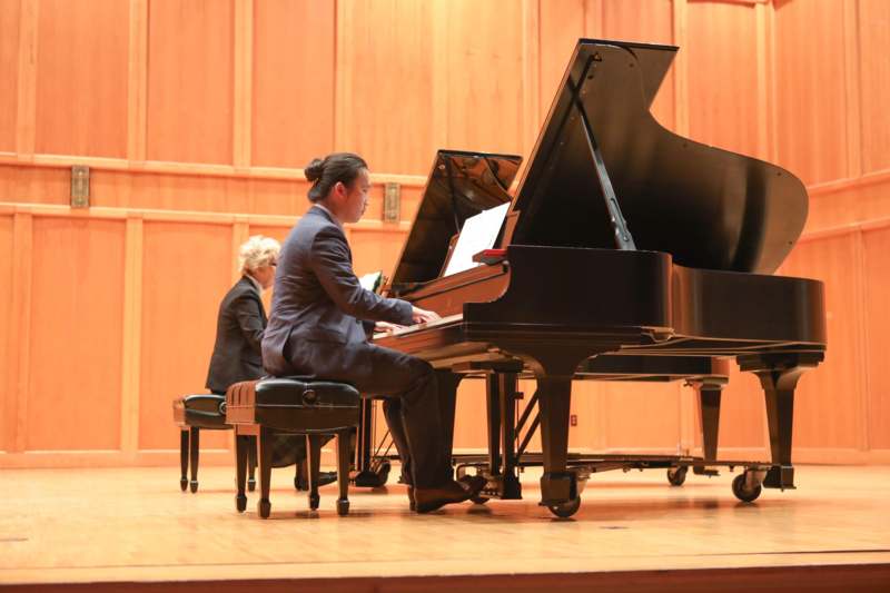 a man playing a piano