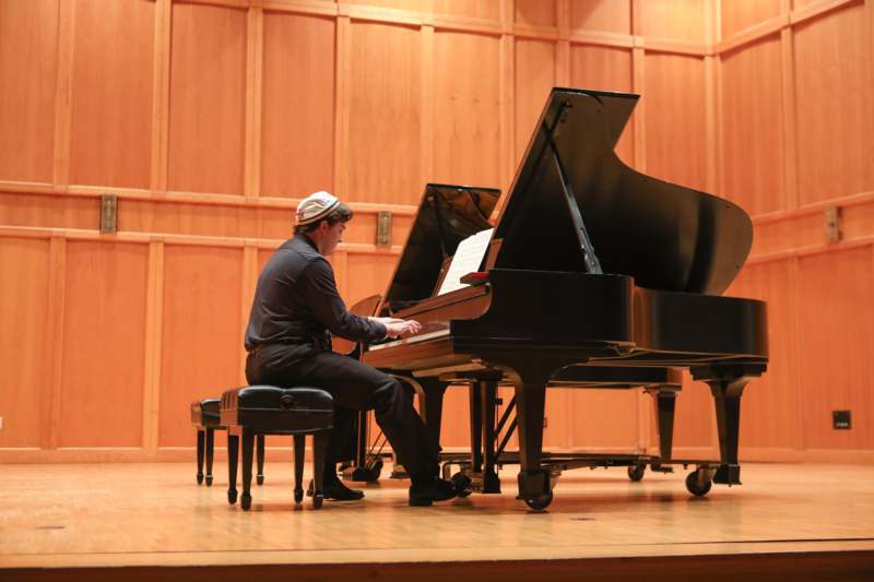 a man playing a piano