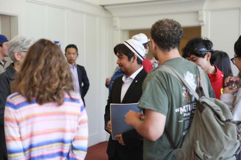 a group of people standing in a room