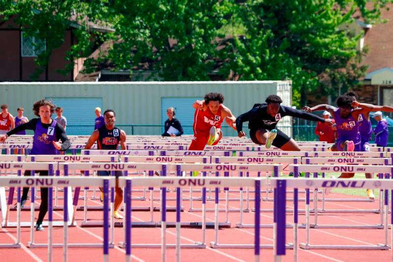 a group of people running on a track