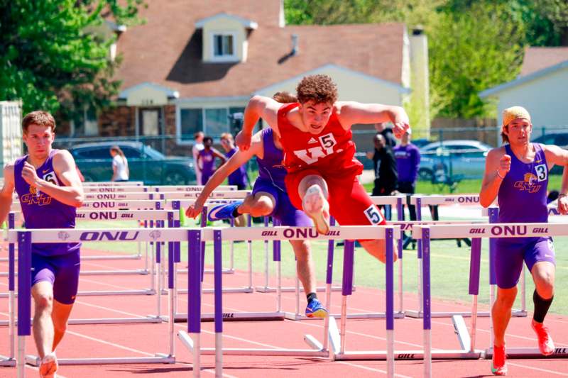 a group of people running on a track