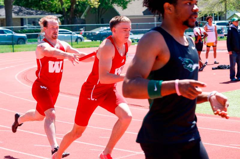 a group of men running on a track