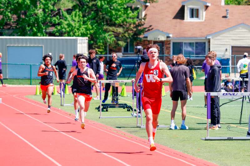a group of people running on a track