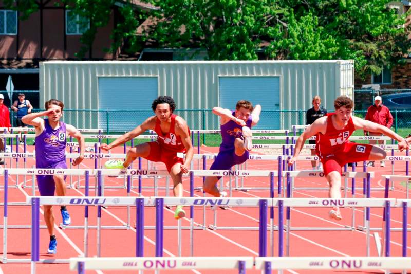 a group of people running on a track