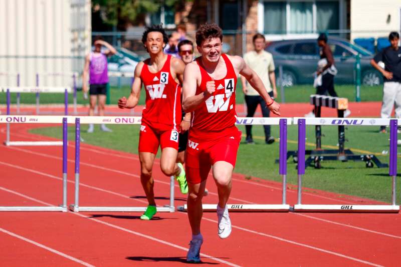 a group of men running on a track