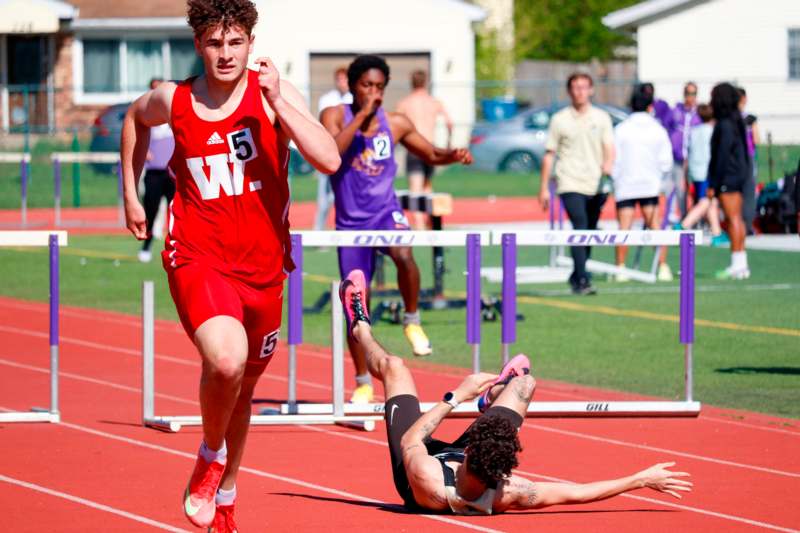 a group of people running on a track