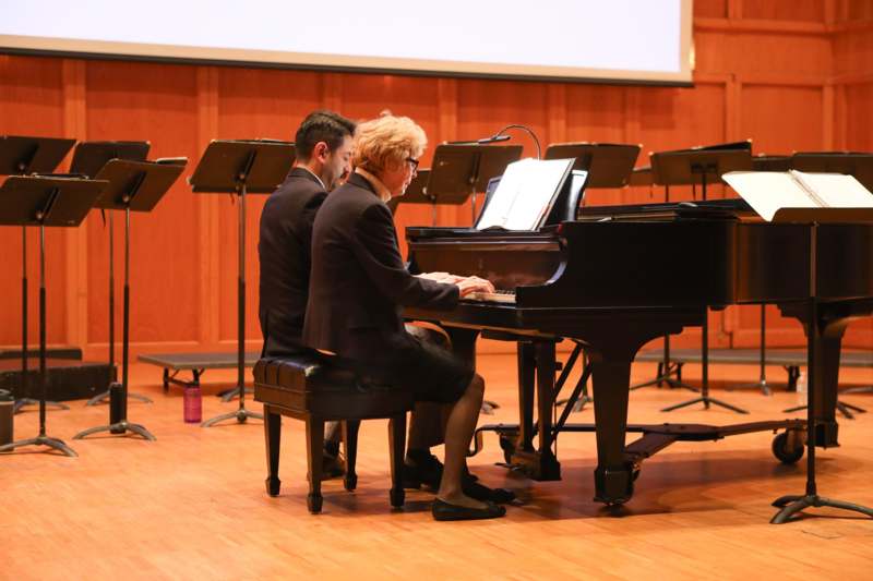 Glee Club Concert - a group of people playing piano
