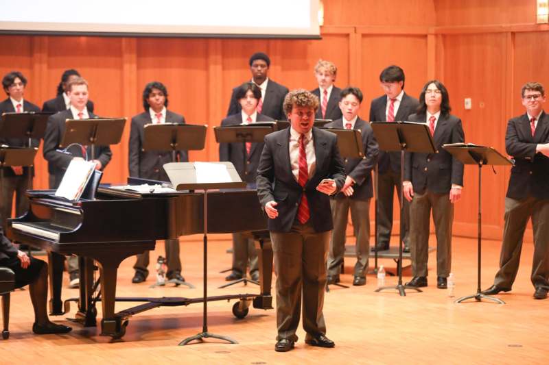 a group of people in suits and ties