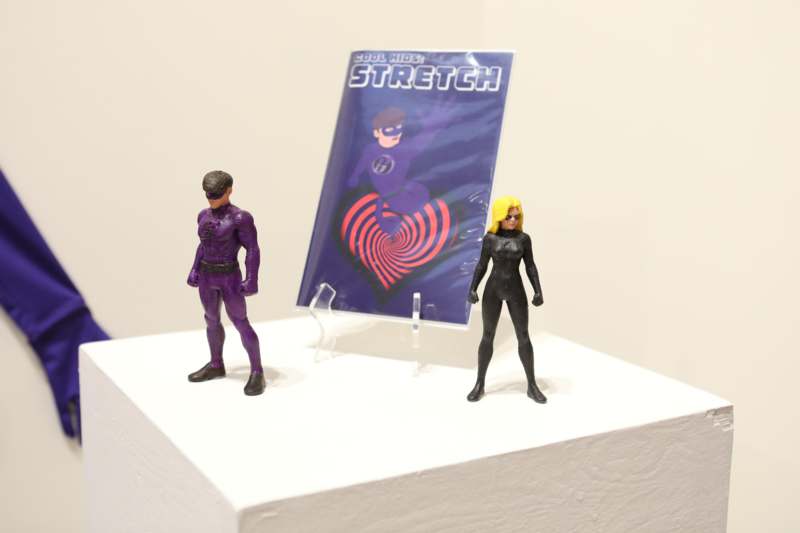 a couple of toy figurines on a white surface