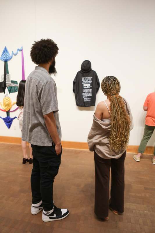 a group of people looking at a wall