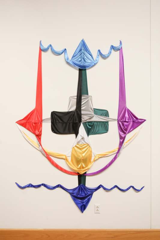 a colorful fabric on a wall