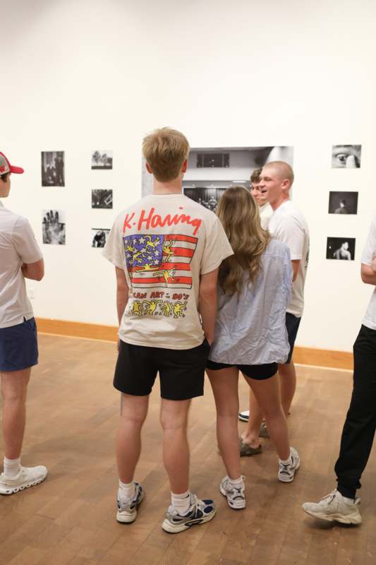 a group of people looking at a picture