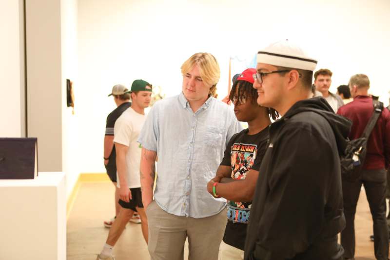 a group of people standing in a room