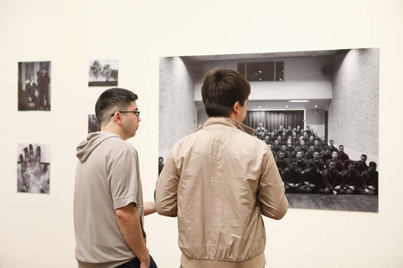 two men looking at a picture