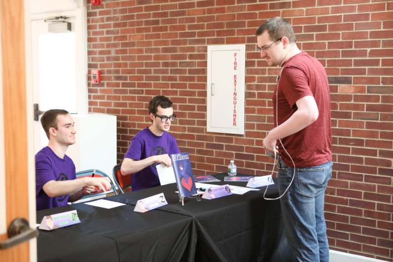 a group of men sitting at a table