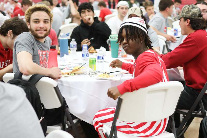 a group of people sitting at a table