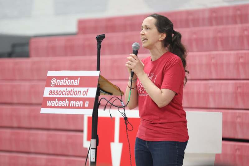 a woman speaking into a microphone