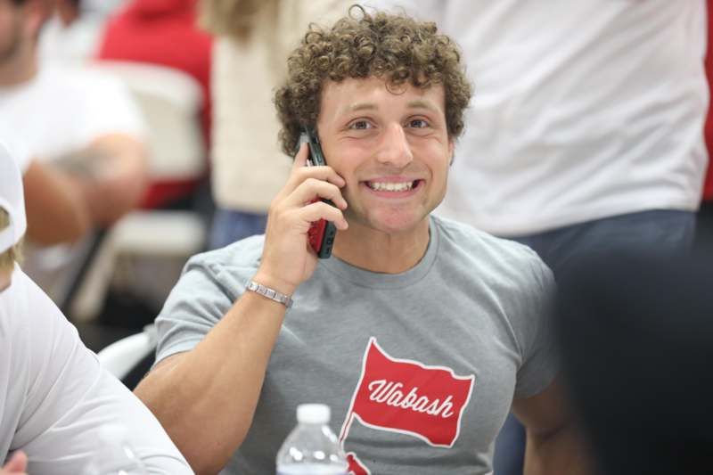 a man holding a cell phone to his ear