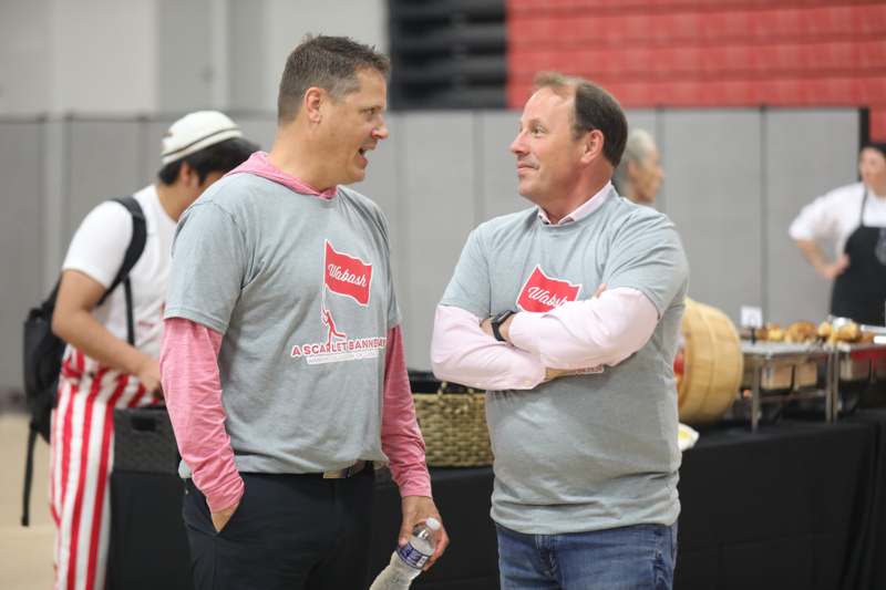 two men in grey shirts
