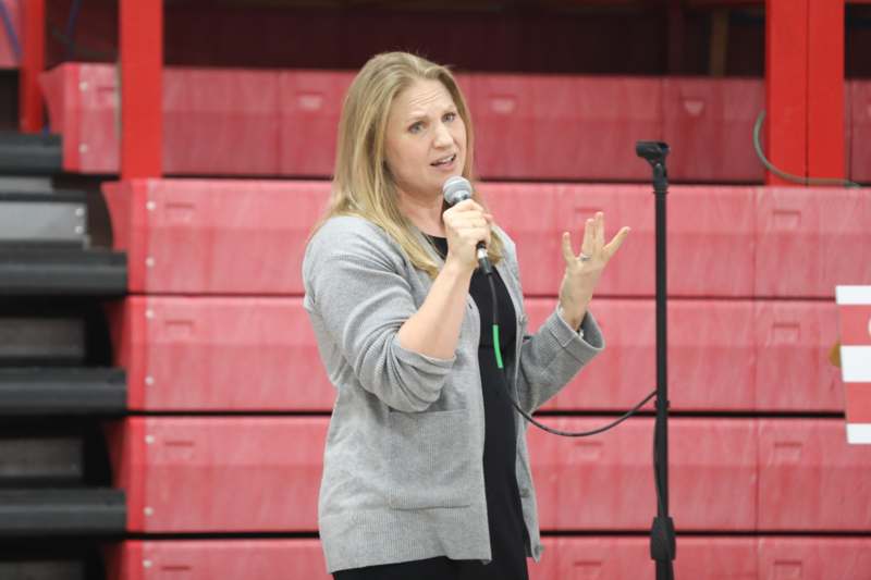 a woman speaking into a microphone