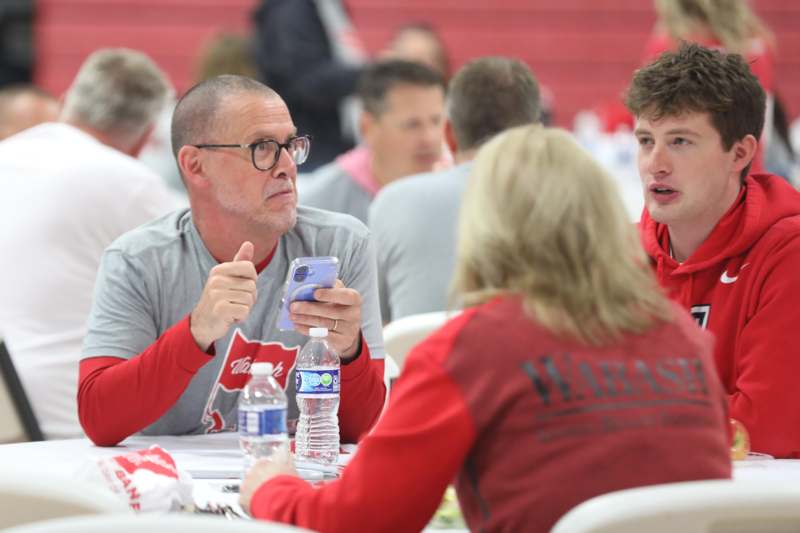 a group of people sitting at a table