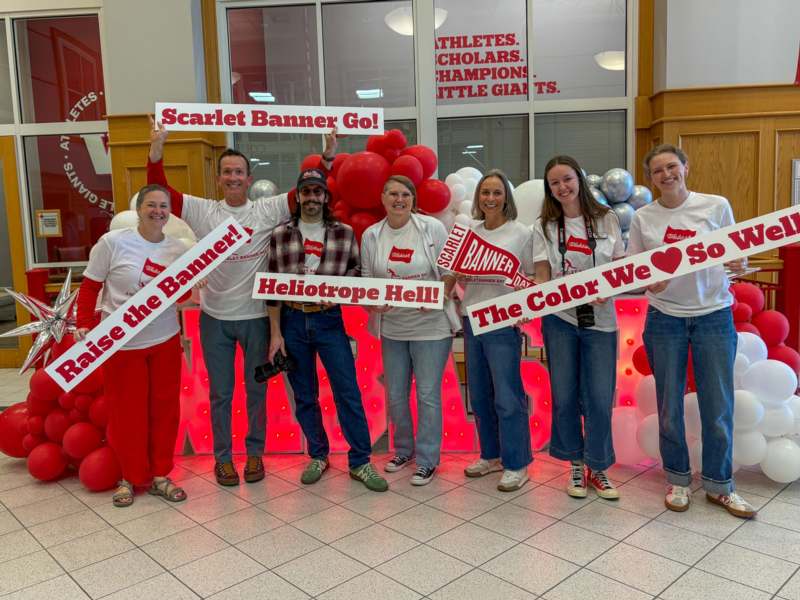 a group of people holding signs