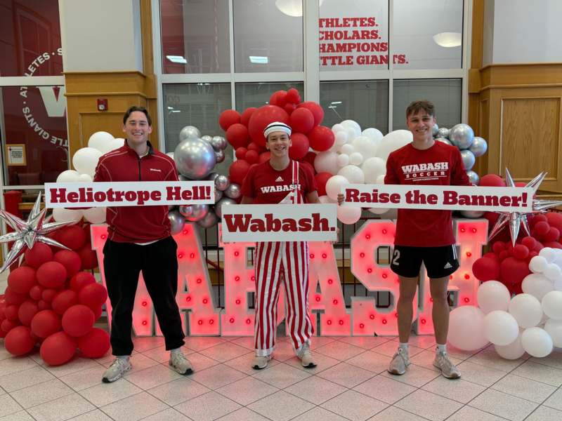 a group of people holding signs