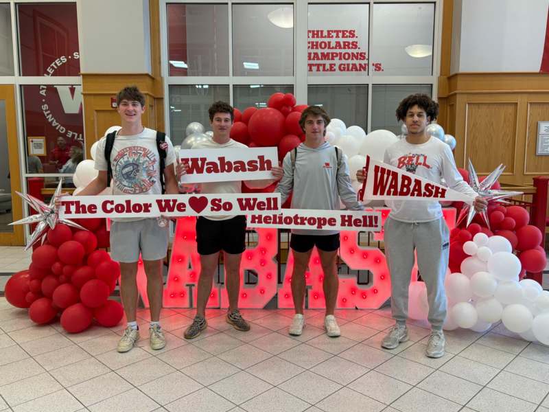 a group of men holding signs