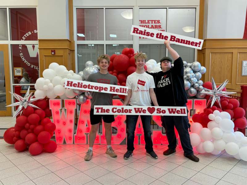 a group of men holding up signs