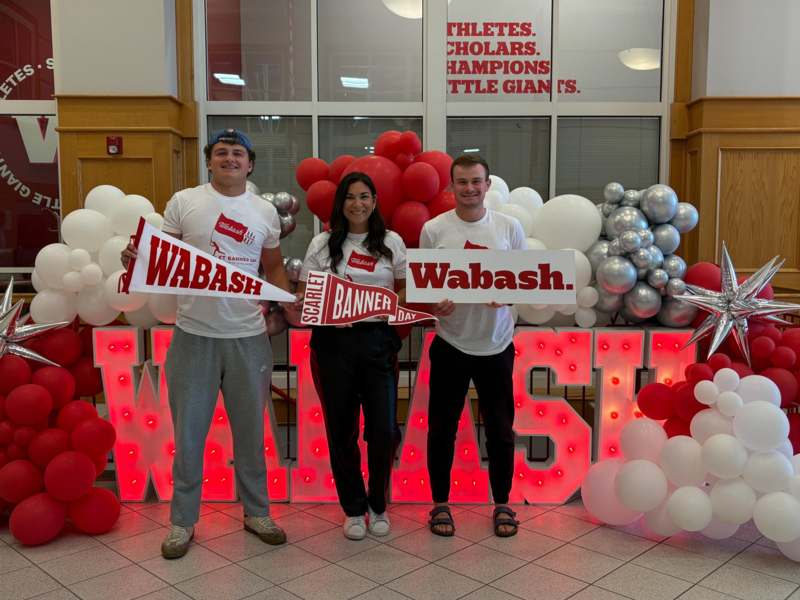a group of people holding signs