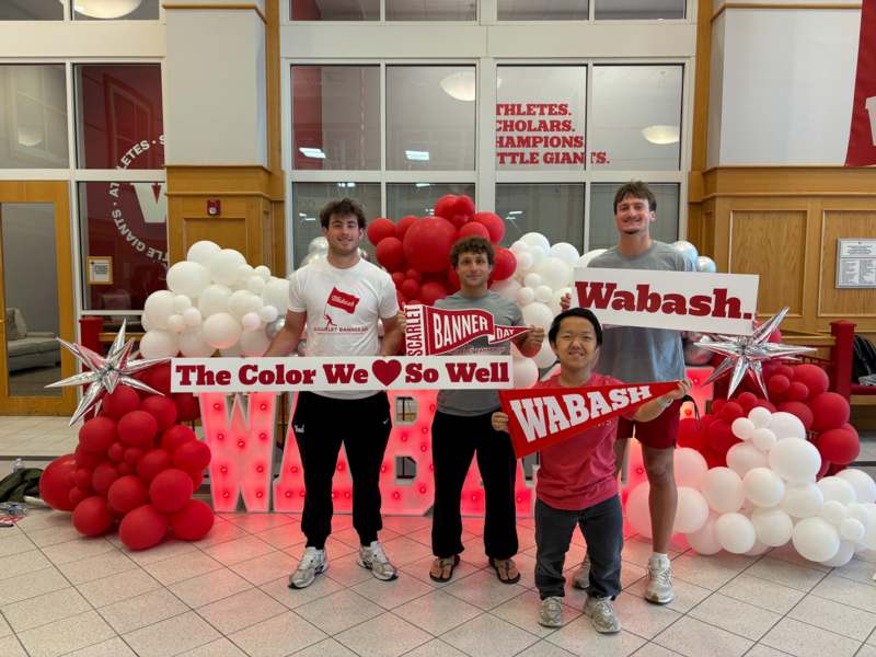 a group of people holding signs