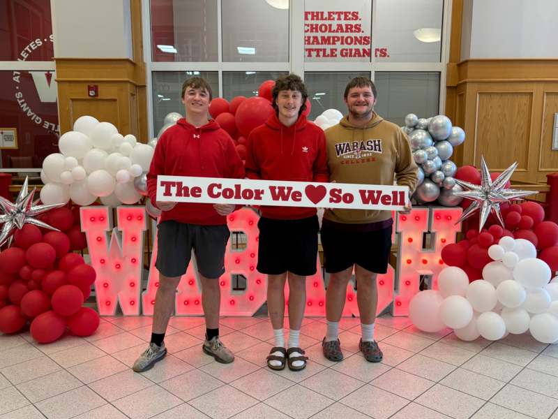 a group of men posing for a photo
