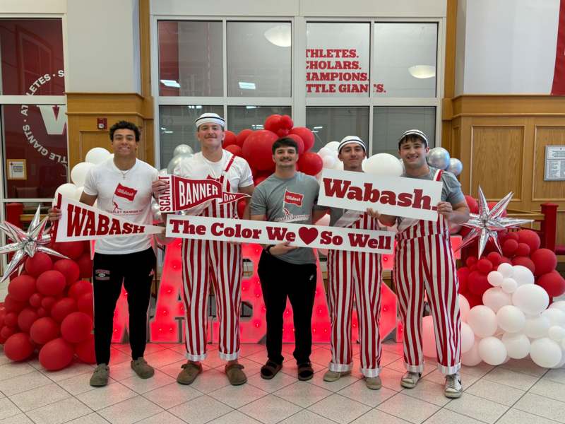 a group of men posing for a photo
