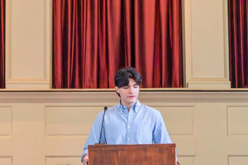 a man standing at a podium