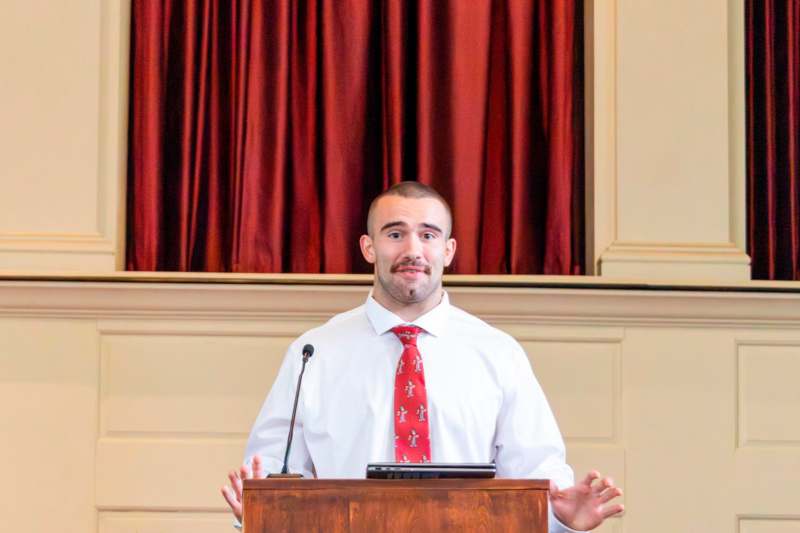 a man standing at a podium