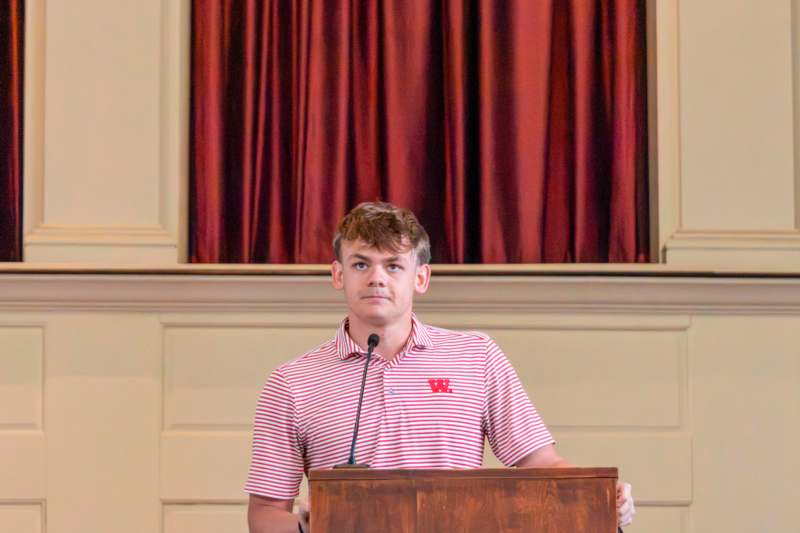 a man standing at a podium