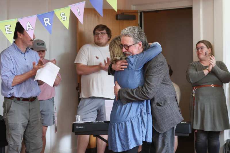 a man hugging a woman
