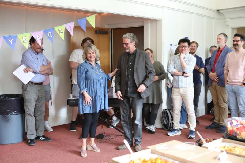 a group of people standing in a room