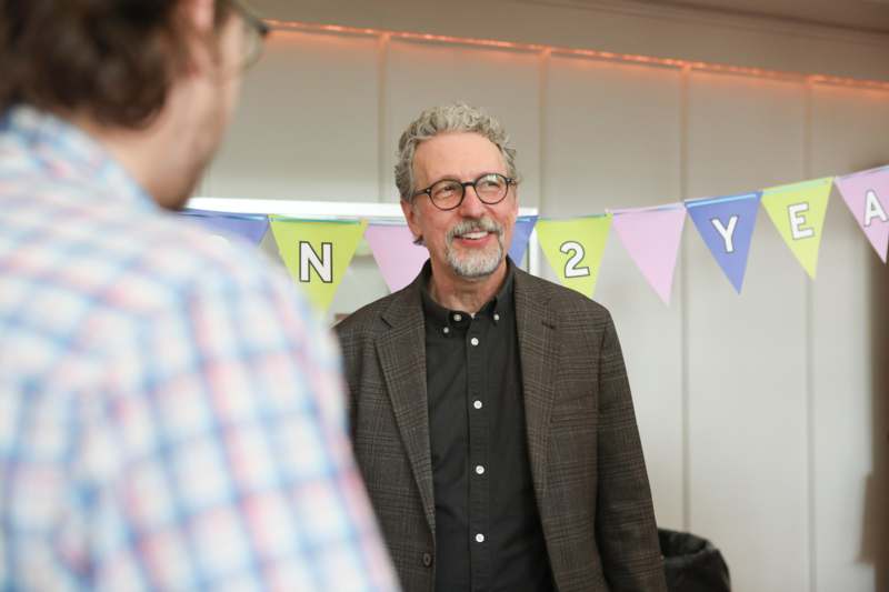 a man in a suit and glasses
