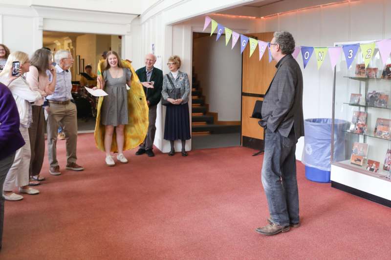 a group of people standing in a room