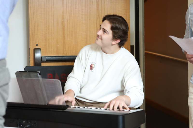 a man playing a piano